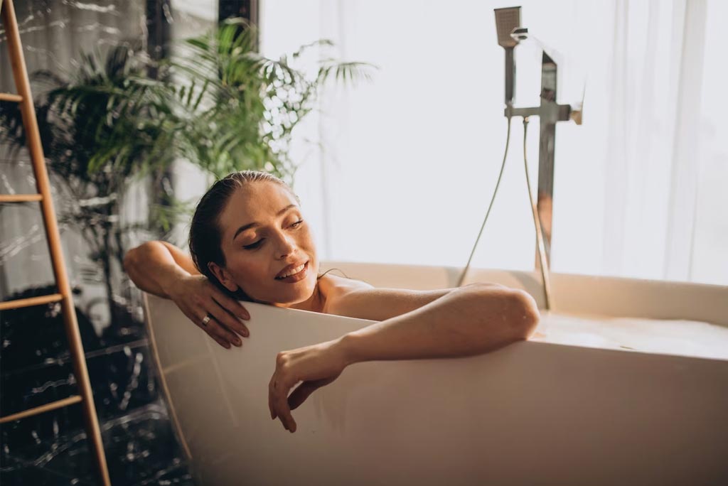Woman with a Smart Lighting while in the bath tub